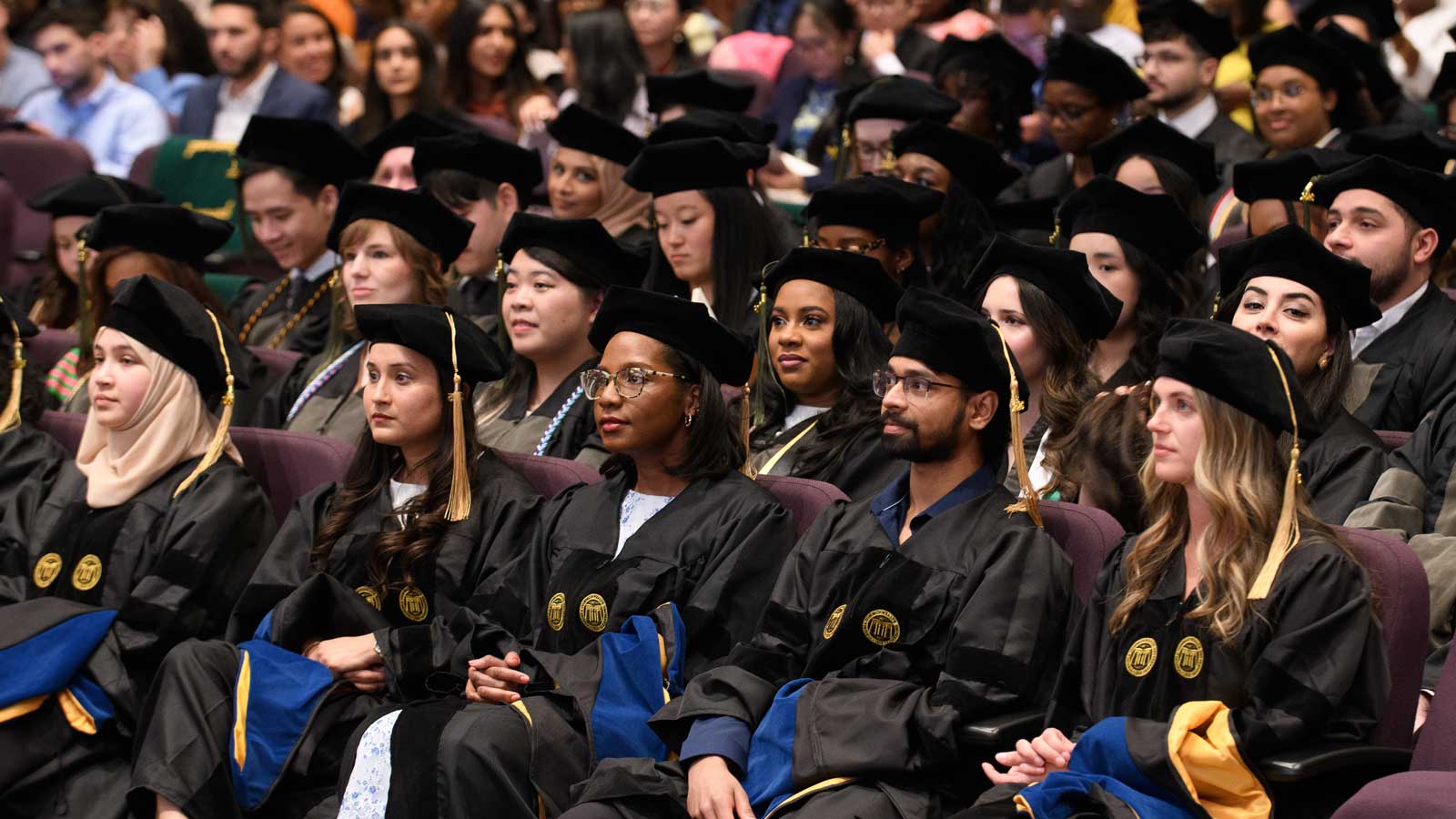 The Class of 2026 listens as Dr. Jade Ranger delivers her commencement speech at the Hooding and Diploma Ceremony.