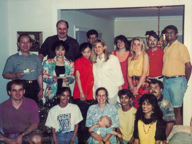 Jurgen Venitz gathers with graduate students, postdocs and their families in this photo from the 1990s