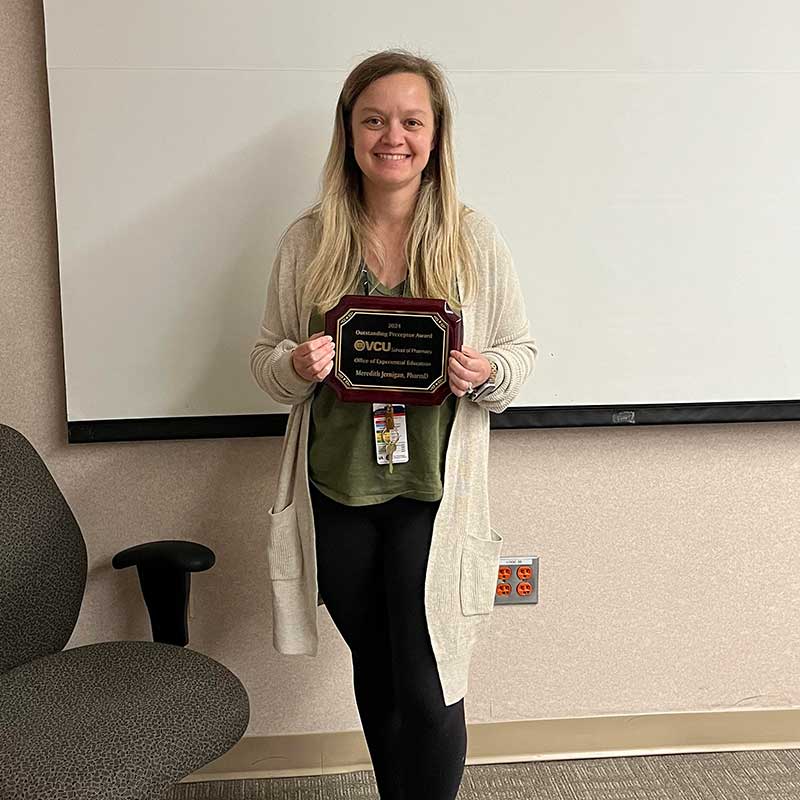 Meredith Jernigan holding preceptor award.