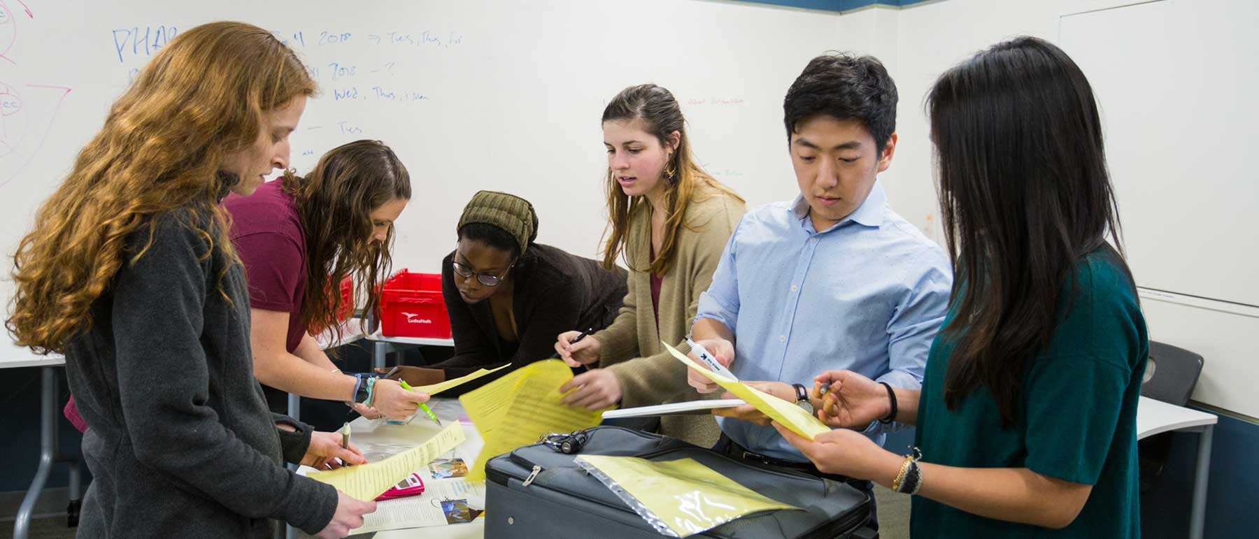 Six students work together on a project.