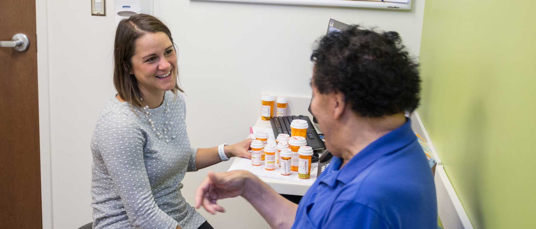 A pharmacist talks with a patient.