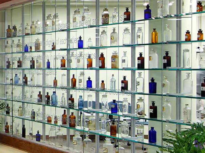 a colorful and large display of apothecary bottles in the lobby of smith building at v.c.u.