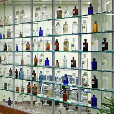 a colorful and large display of apothecary bottles in the lobby of smith building at v.c.u.